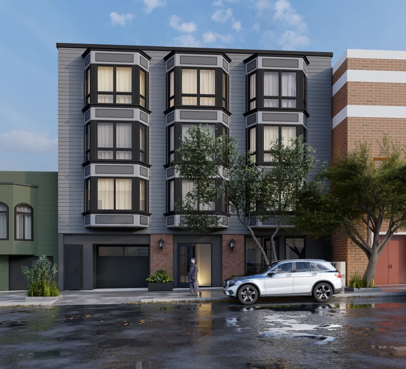 A white car parked in front of a tall building